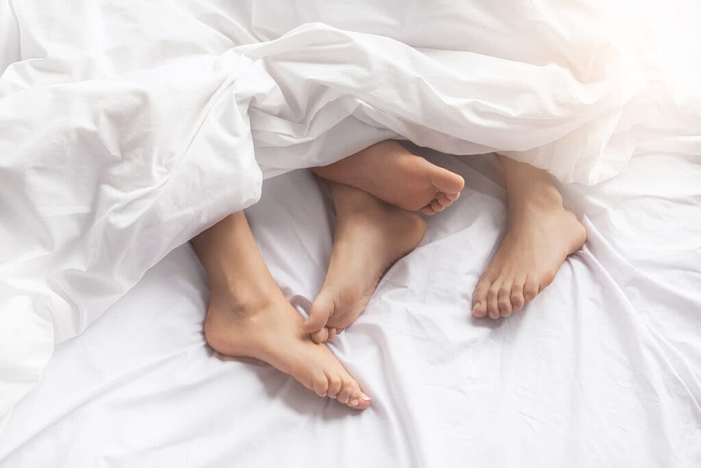 Couple understanding and communicating their desires and levels of intimacy in bed.